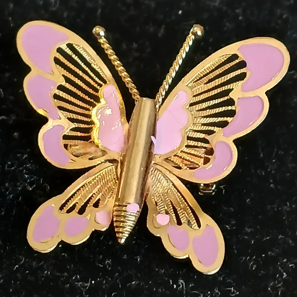 Vintage goldtone filigree butterfly brooch with pink accents